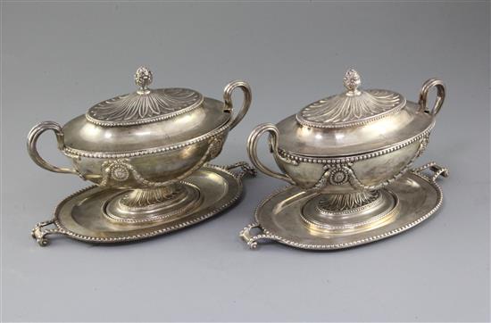 A pair of George III silver oval two handled sauce tureens, covers and stands by Tudor & Leader, 44.5 oz.